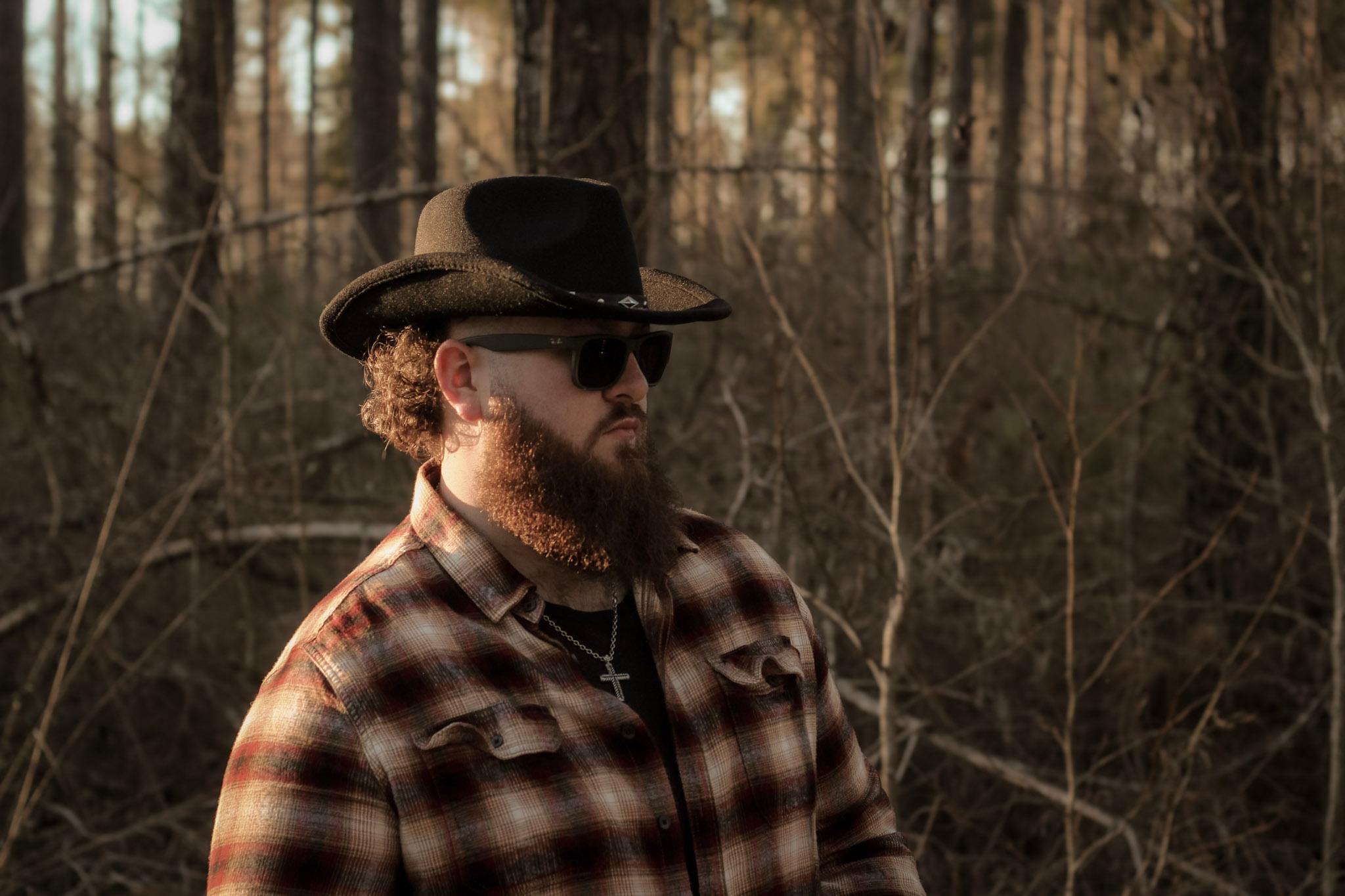 Aden Webb in the woods